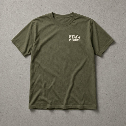 Military green t-shirt with small cream Stay Positive left-chest logo – Stay Positive by The Hillbillies, front view