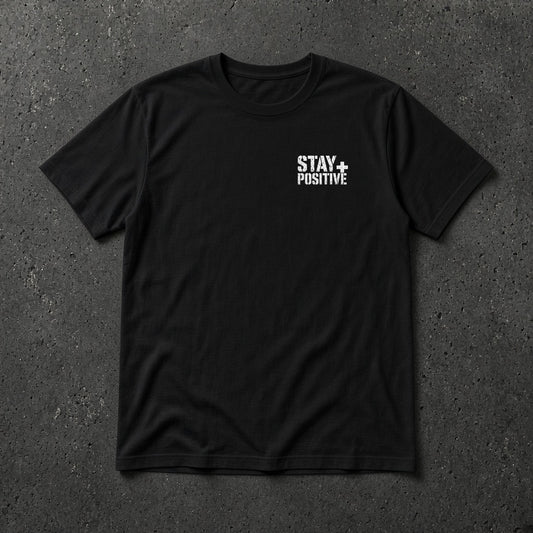 Black t-shirt with small white Stay Positive left-chest logo – Stay Positive by The Hillbillies, front view