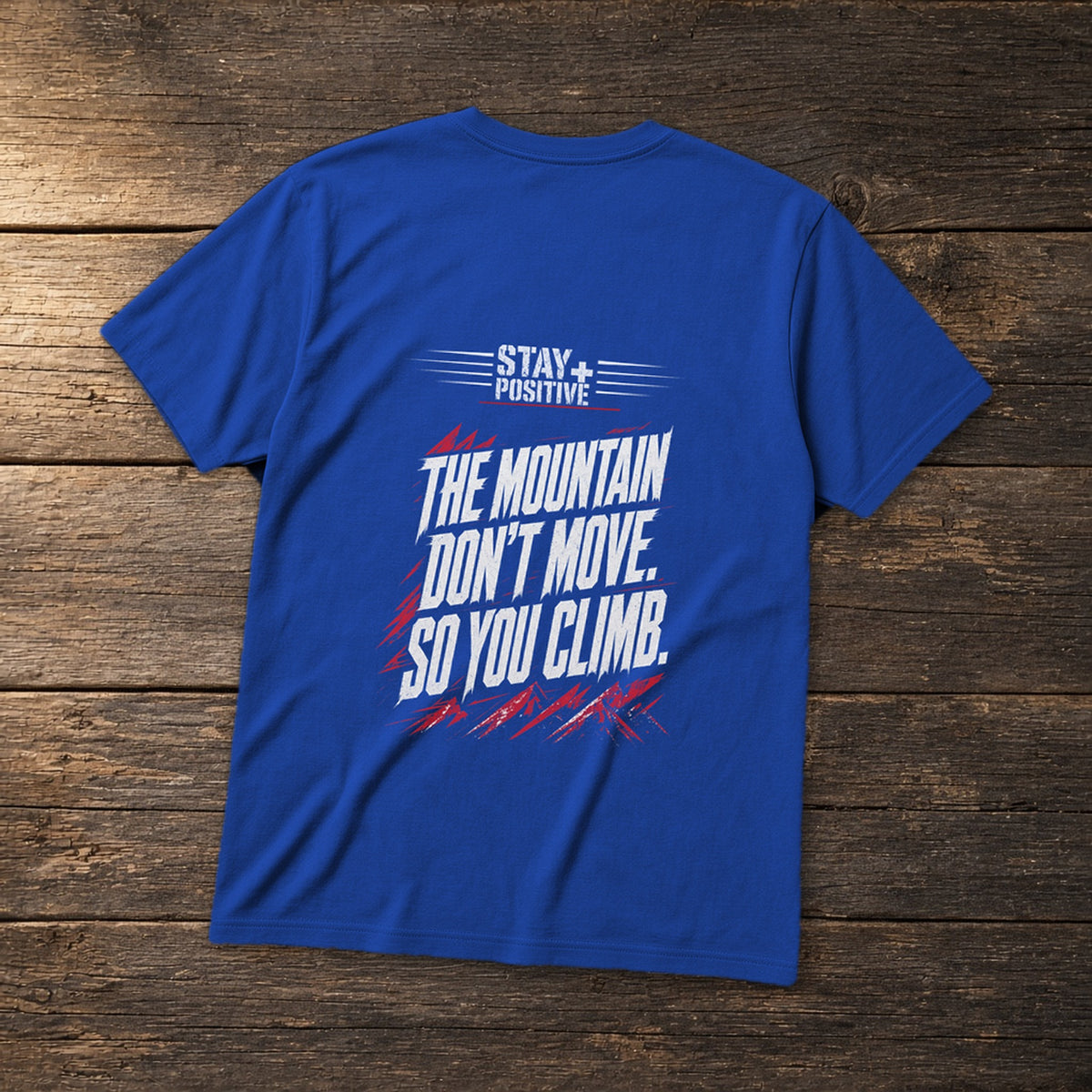 The Mountain Don't Move Tee in Royal, flat lay – Stay Positive