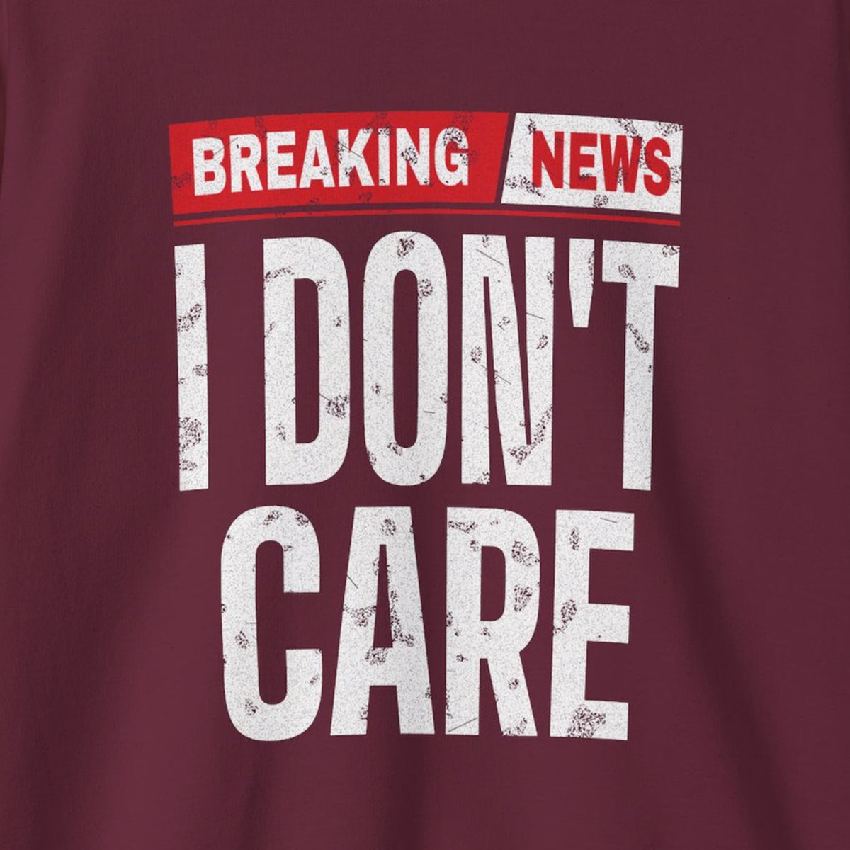 Breaking News I Don't Care Sweatshirt – Maroon – front print close-up