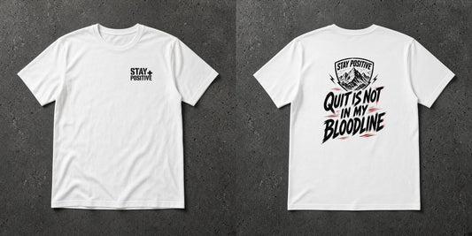 White t-shirt with small Stay Positive chest logo and distressed black 'Quit Is Not in My Bloodline' mountain shield back print – Stay Positive by The Hillbillies, front and back view