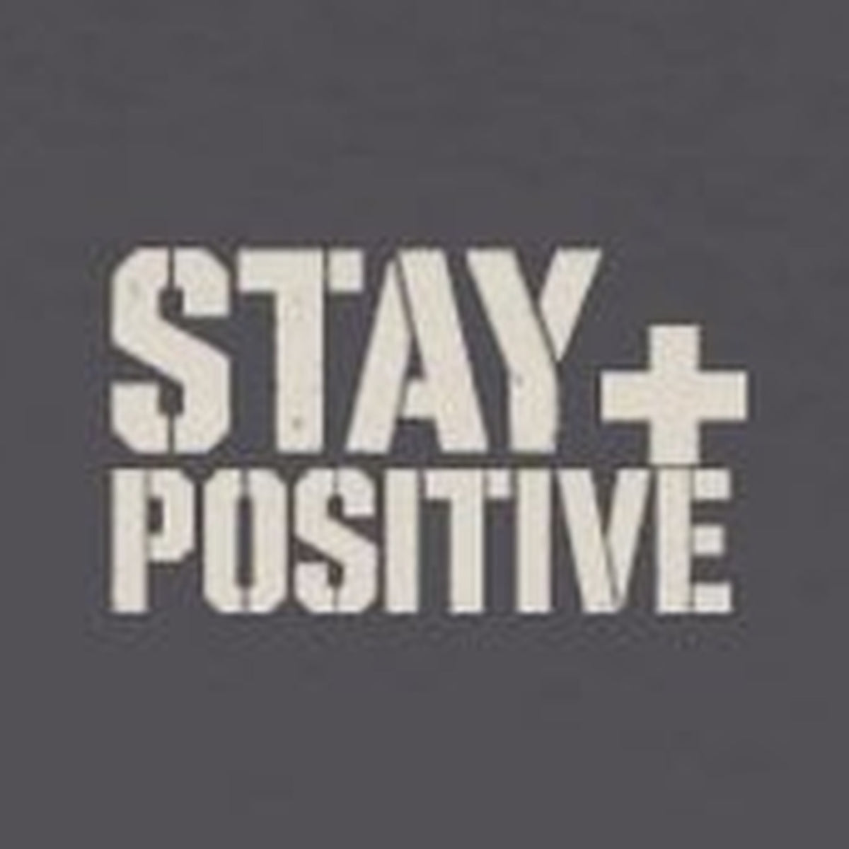 Comfort Never Built Nothin' Long Sleeve Tee – Stay Positive – Charcoal – front print close-up