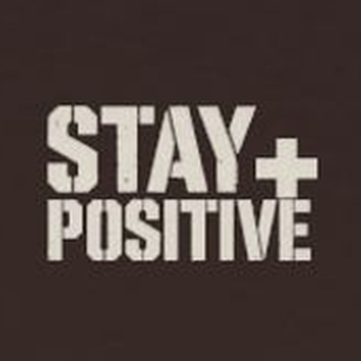 Comfort Never Built Nothin' Long Sleeve Tee – Stay Positive – Dark Chocolate – front print close-up