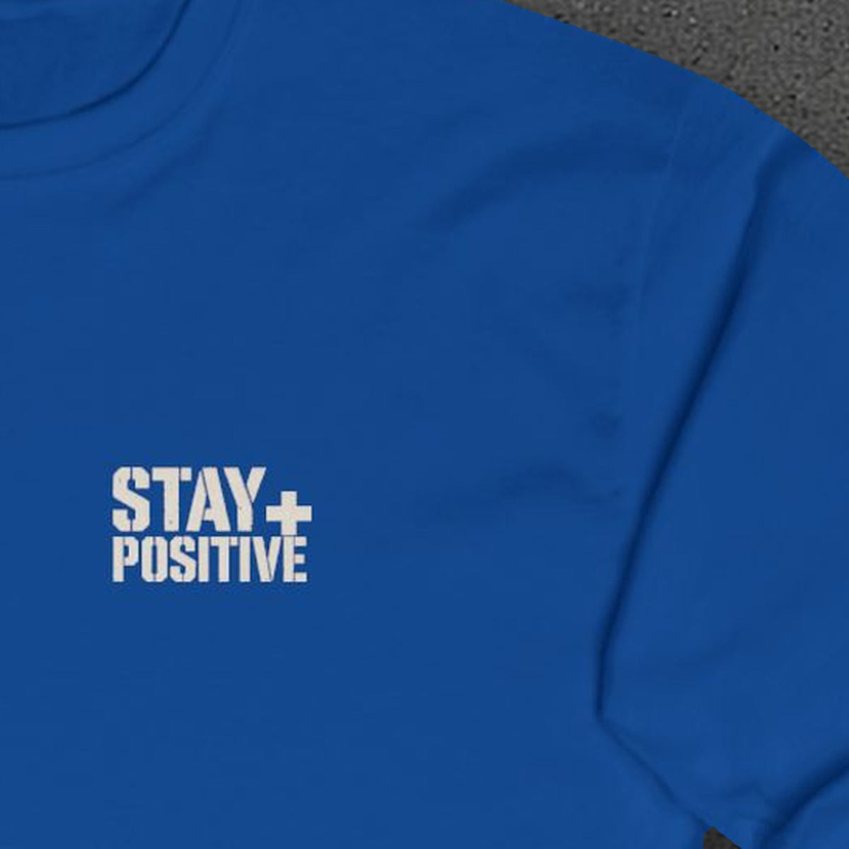 Comfort Never Built Nothin' Long Sleeve Tee – Stay Positive – Royal – front print close-up