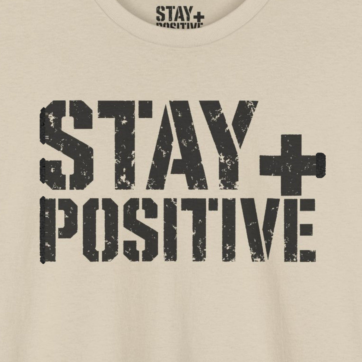 Stay Positive Logo Tee – Sand – front print close-up