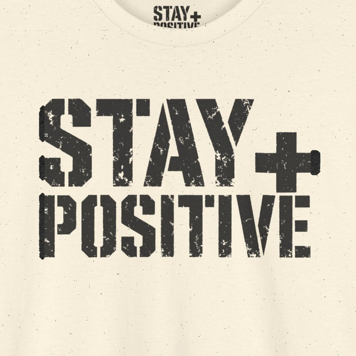 Stay Positive Logo Tee – Natural – front print close-up