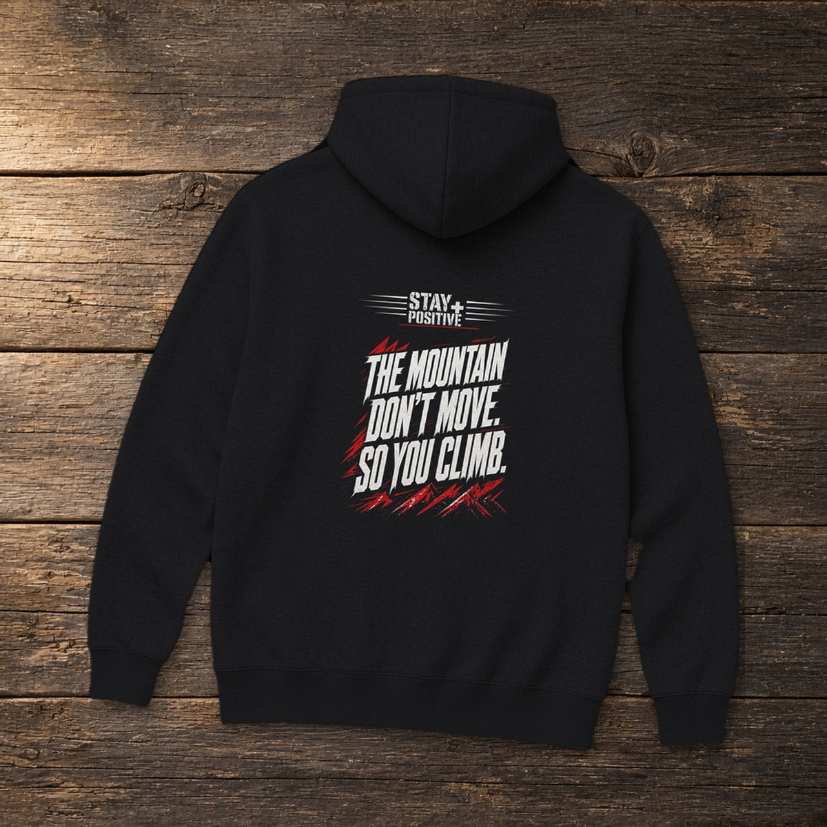 The Mountain Don't Move Hoodie in Black, flat lay – Stay Positive