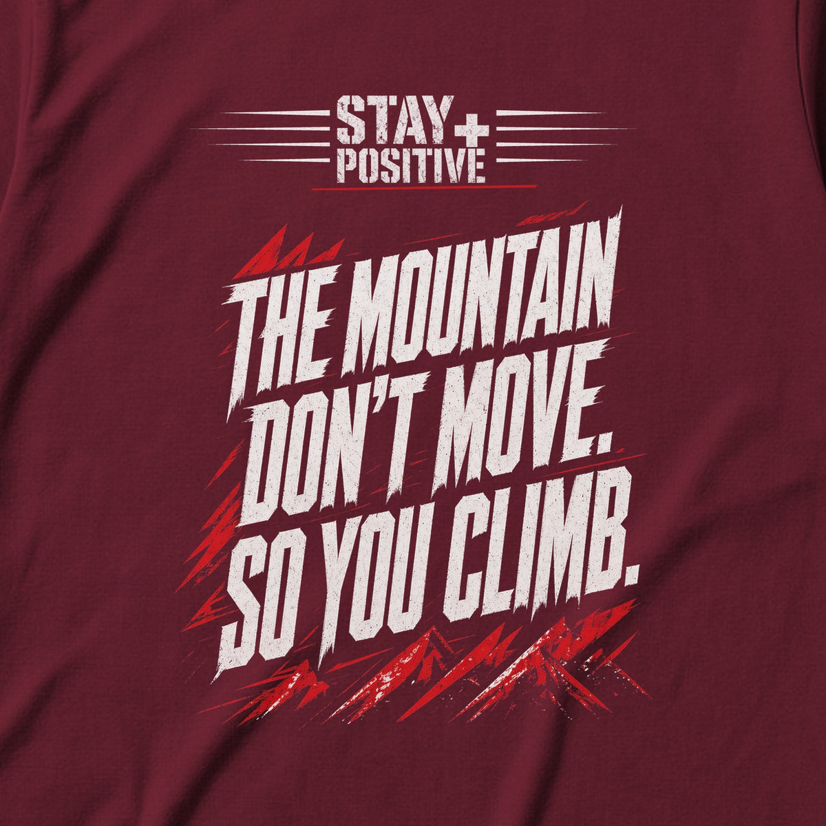 The Mountain Don't Move Tee in Maroon, close-up of the print – Stay Positive