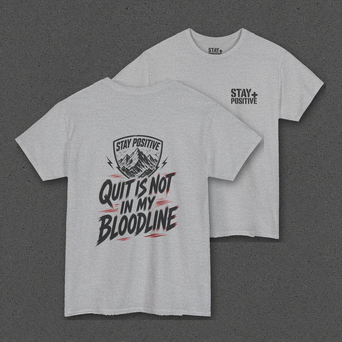 Quit Is Not in My Bloodline Tee – Stay Positive – Sport Grey – two-shirt back print in front, other side offset behind