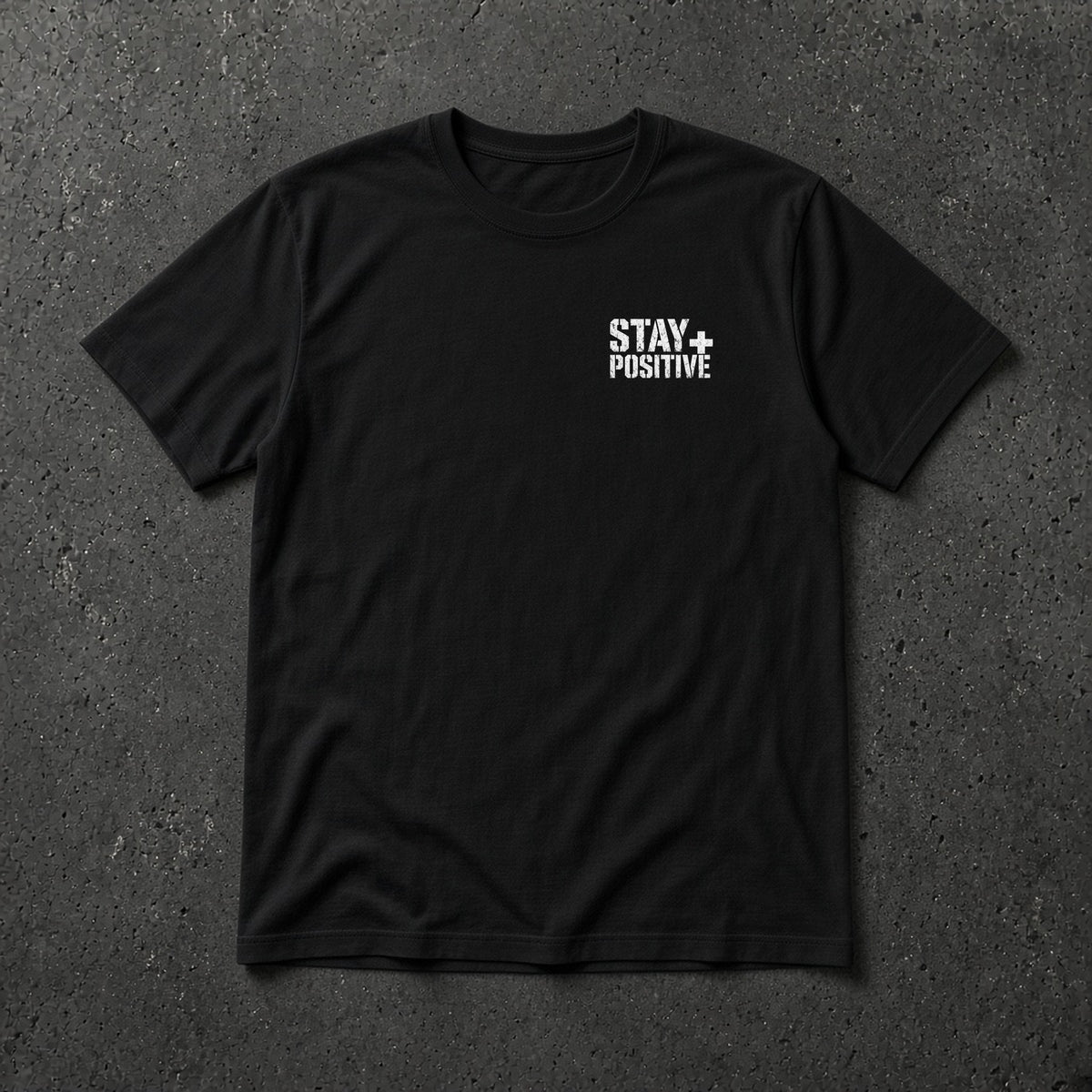 Black t-shirt with small white Stay Positive left-chest logo – Stay Positive by The Hillbillies, front view