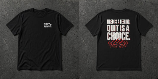 Black t-shirt with white Stay Positive chest logo and distressed white 'Tired Is a Feeling. Quit Is a Choice.' back print with red cracks – Stay Positive by The Hillbillies, front and back view